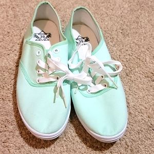 Mint green sneakers.
